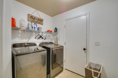 a small laundry room with a washer and dryer at Coastal Retreat Near Redwoods and 2 Miles to Beach! in Crescent City