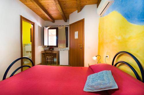 Ένα ή περισσότερα κρεβάτια σε δωμάτιο στο Agriturismo Piperedda