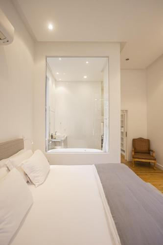 Ένα ή περισσότερα κρεβάτια σε δωμάτιο στο Felissimo Exclusive Hotel