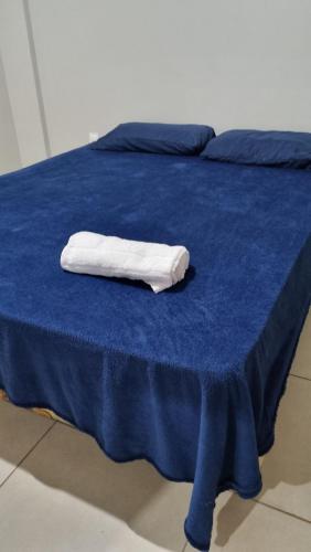 a white towel sitting on top of a blue bed at Ed Bella Italia in Toledo