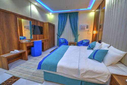 Ένα ή περισσότερα κρεβάτια σε δωμάτιο στο سي مون للشقق الفندقية sea moon hotel