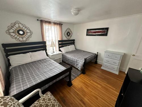 a bedroom with two beds and a window at Farmhouse 2 bedrooms apartment in Lynn
