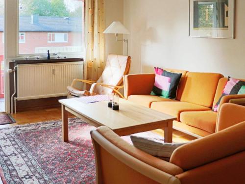 a living room with two couches and a coffee table at 4 person holiday home in HYLTEBRUK-By Traum in Hyltebruk