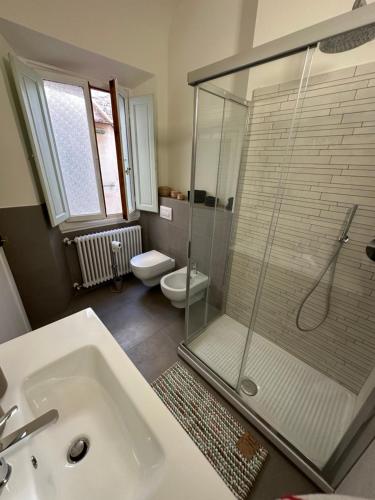 a bathroom with a shower and a sink and a toilet at Dante Alighieri - Casa Babette in Florence