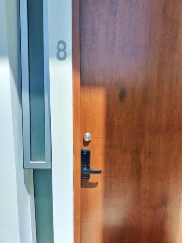 a wooden door with a knob on it at Casa Laak Fabulous rustic townhouse in Mérida