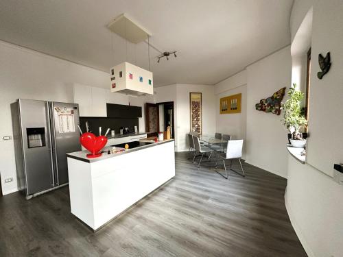 a kitchen with a refrigerator and a counter top at Diego's House in Aci Castello