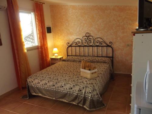 a bedroom with a bed with a box on it at MareSole a Capitana in Capitana