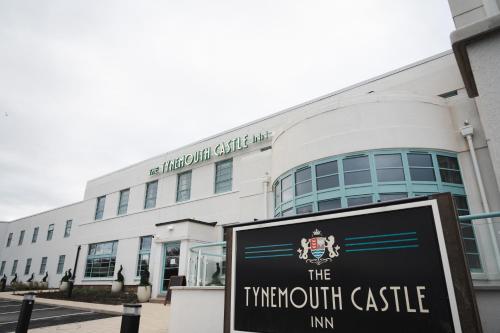 a building with a sign in front of it at The Tynemouth Castle Inn - The Inn Collection Group in Tynemouth