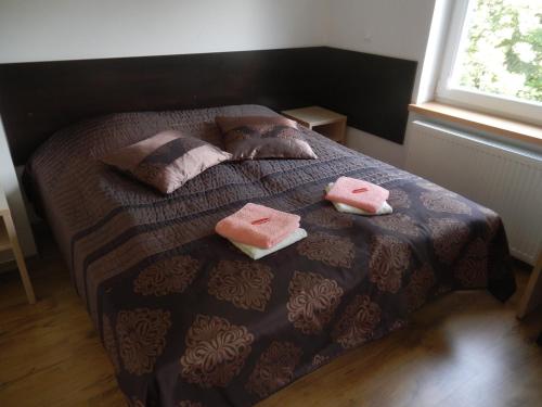 Una cama o camas en una habitación de Melafir Pensjonat