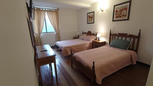 En eller flere senge i et værelse på Hotel Silvia by Destino Pacifico