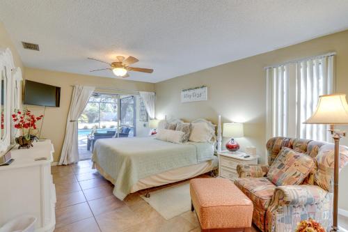 a bedroom with a bed and a couch at Prime Largo Vacation Rental with Lanai and Pool! in Largo
