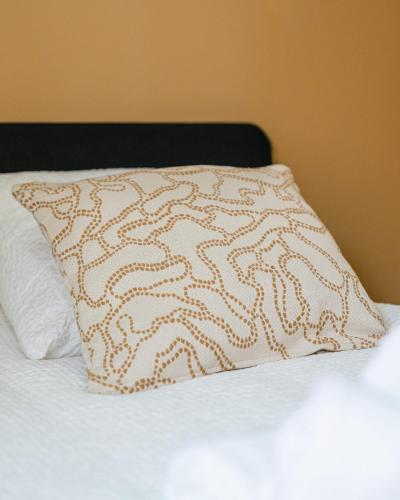 a pillow sitting on top of a bed at Studio Nicehome Massena in Nice