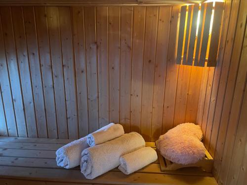 a sauna with towels sitting on a wooden shelf at Chalet Free Sauna & Spa SuperKing bed in Killaloo