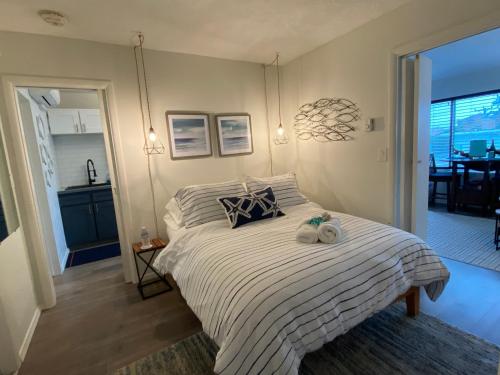 a bedroom with a bed with two towels on it at Condo by the Sea in Lincoln City