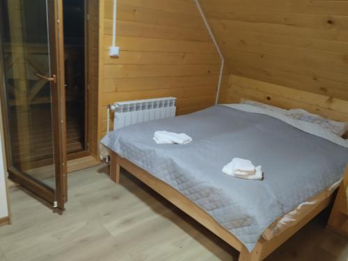 Postel nebo postele na pokoji v ubytování Chabrowe Roztocze
