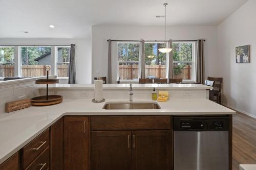 a kitchen with a sink and a counter at 172 Avocet home in Sunriver