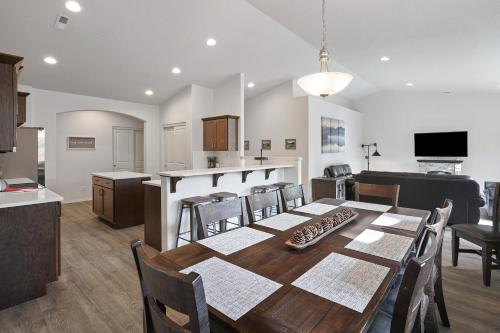 a dining room and kitchen with a table and chairs at 172 Avocet home in Sunriver