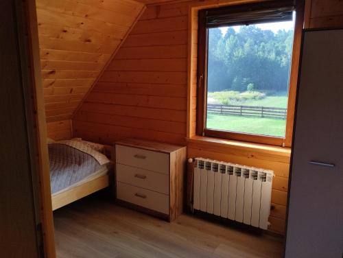 Postel nebo postele na pokoji v ubytování Chabrowe Roztocze