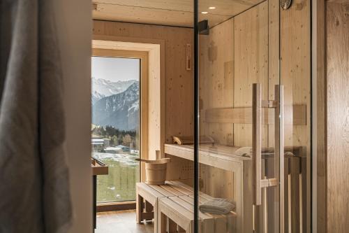 a sauna with a view of the mountains at Jagdhof PURE Mountain Appartements in Tux