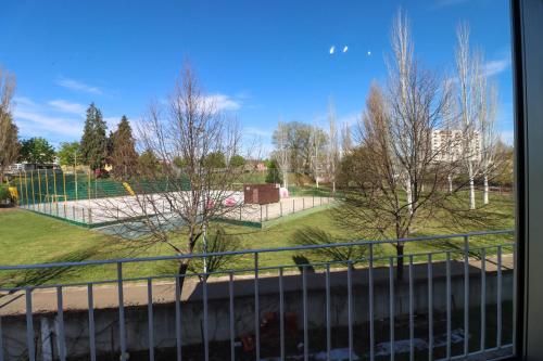 a view of a park from a window at Guest House Chaves in Chaves