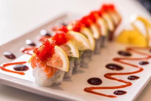a row of sushi on a white plate at Eldorado Reno, A Caesars Destination in Reno