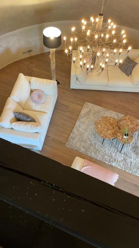 a table with pillows and a chandelier on top of a table at LES GITES DE LA KARLSMUHLE in Haguenau
