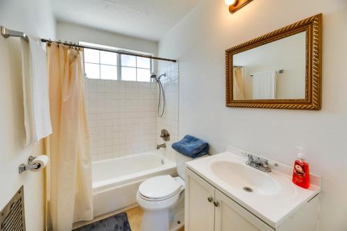 a bathroom with a sink and a toilet and a mirror at North Hollywood Home about 3 Mi to Universal Studios! in North Hollywood