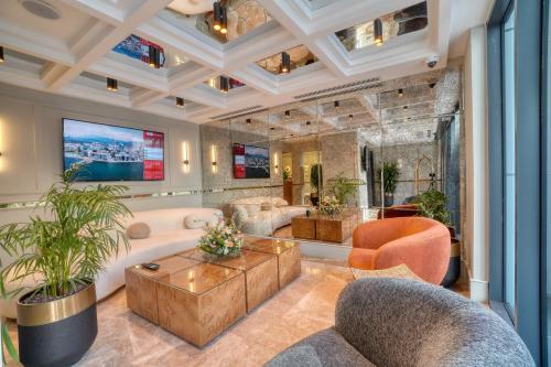 a living room with a coffered ceiling at İbos Hotels Izmir in Izmir