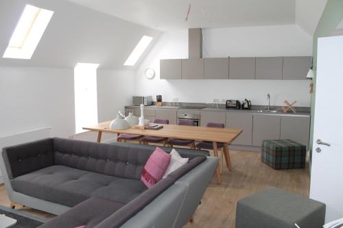 a living room with a couch and a table at John O'Groats in John O Groats