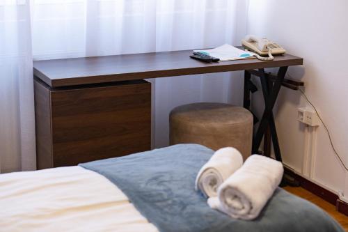 Ένα ή περισσότερα κρεβάτια σε δωμάτιο στο Artearia Hotel