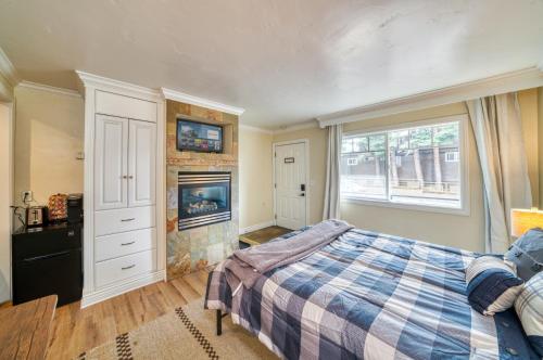 a bedroom with a bed and a fireplace at Moose and Maple Lodge in South Lake Tahoe