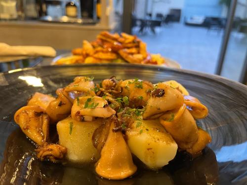 a plate of food on a table at Casal de pelaio in Barreiros