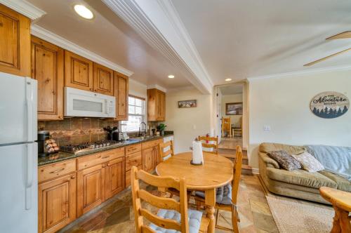 a kitchen and living room with a table and a couch at Moose and Maple Lodge in South Lake Tahoe