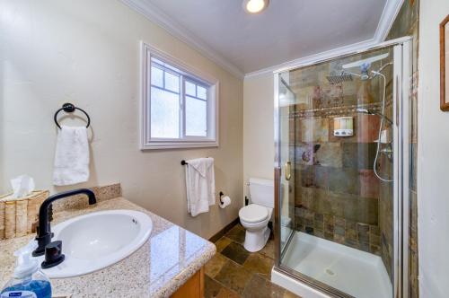 a bathroom with a sink and a shower at Moose and Maple Lodge in South Lake Tahoe