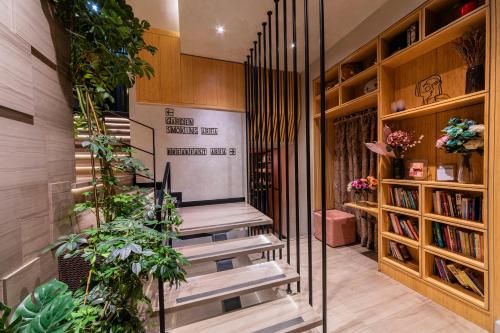 a staircase in a house with plants and books at Ayramin Deluxe Hotel Taksim in Istanbul