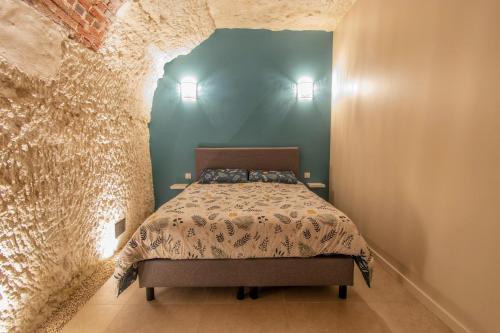 Posteľ alebo postele v izbe v ubytovaní Gîte troglodyte - Troglo du Pontcher