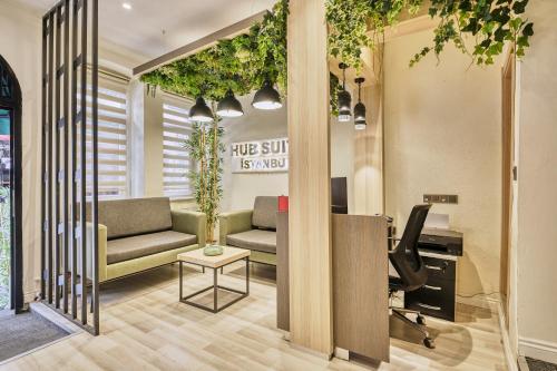 a living room with a couch and a table at Hub Suite Istanbul in Istanbul