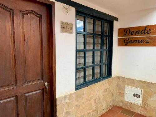 a door to a dance center with a window at Casa Donde Gomez in Villa de Leyva