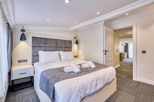 a bedroom with a large bed with two towels on it at Hub Suite Istanbul in Istanbul