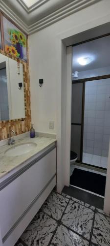 a bathroom with a sink and a toilet at Casa 02 Quartos em frente às Praias mais belas de Salvador in Salvador