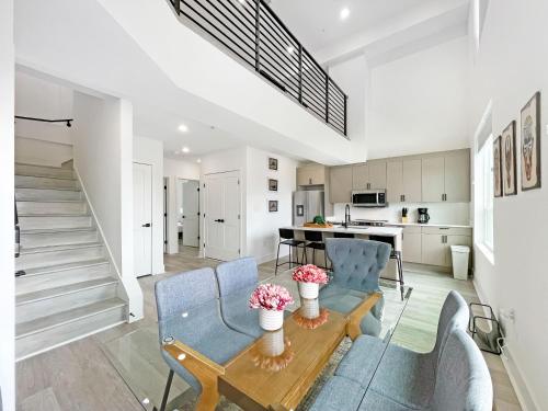 a kitchen and living room with a table and chairs at Mary's Stay Brookland in Washington