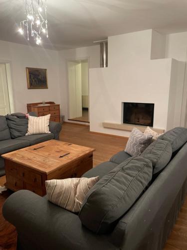 a living room with a couch and a coffee table at Casa Anna in Villach