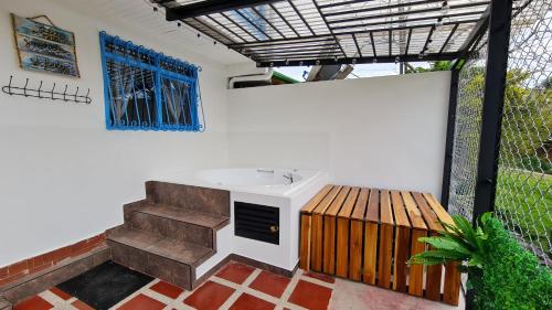 a bathroom with a sink and a wooden deck at Casa Selah - Una pausa entre café y montañas in Salento