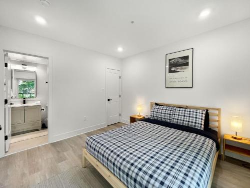 a bedroom with a bed and a bathroom with a window at Mary's Stay Brookland in Washington