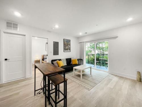 a living room with a couch and a table at Mary's Stay Brookland in Washington