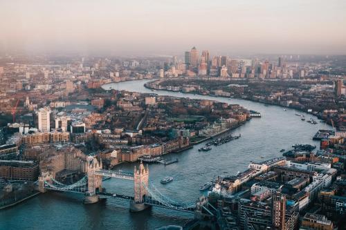 an aerial view of the river thames and the london bridge at Manhattan Pad in London