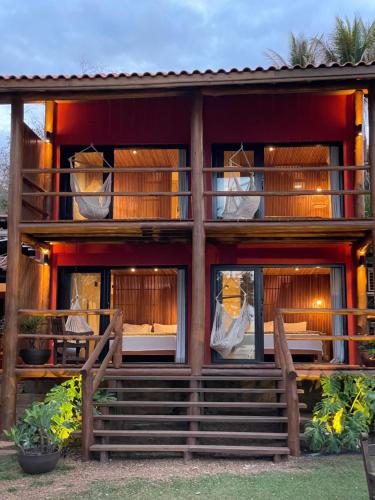 a house with windows and balconies on it at Pousada da Pedra Rifaina in Rifaina