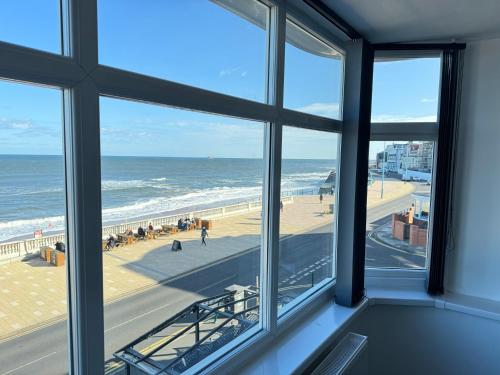 a view of the beach from a window at Seaviews Apartment 2, Whitley Bay Sea Front in Whitley Bay