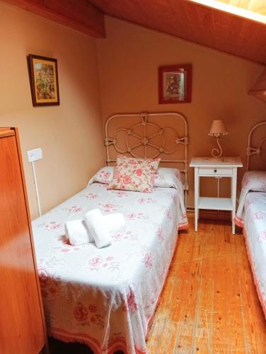 Ένα ή περισσότερα κρεβάτια σε δωμάτιο στο Casa Pelayo 2