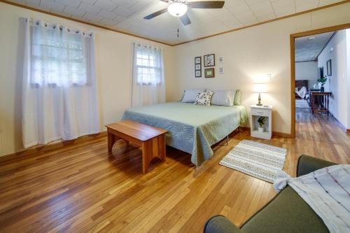 a bedroom with a bed and a table in a room at Mayville Vacation Rental - Walk to Chautauqua Lake in Mayville